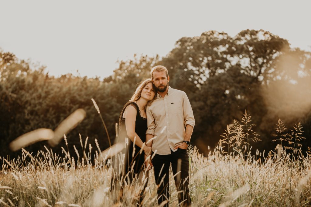 couple in tall grass at brushy creek state park 